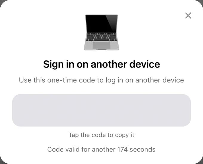 The Sign in on another device window in the app with a one-time code
